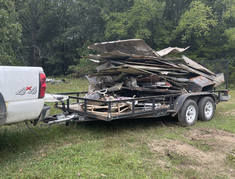 A truck with trolley loaded of junks